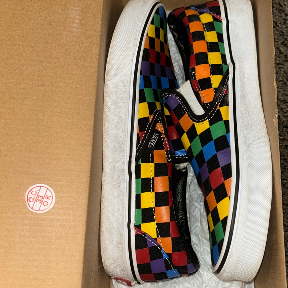 Black rainbow slip-on checkered vans